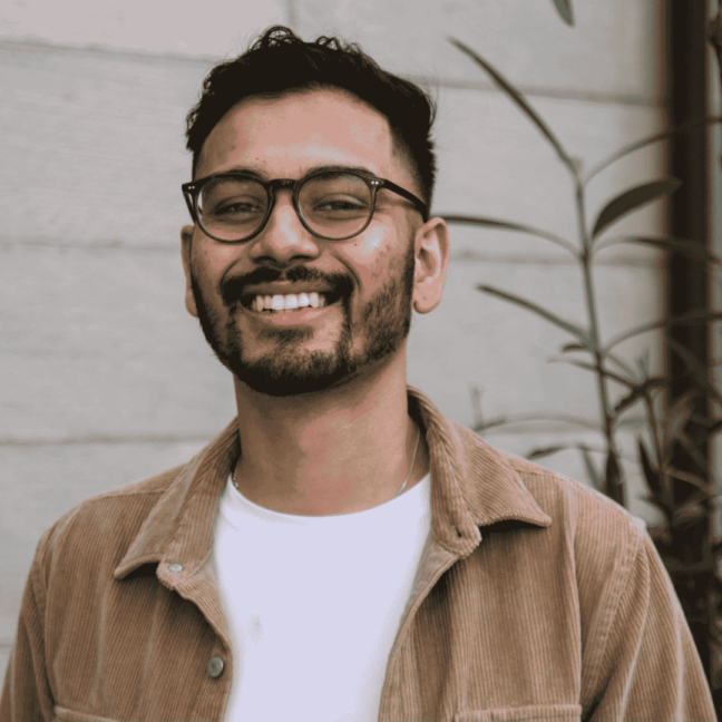 man wearing glasses, wearing brown polo